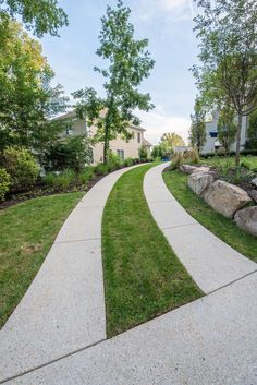 a walkway in the middle of a grassy area