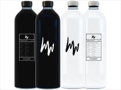 three different types of bottled water bottles with labels on them, one black and one white