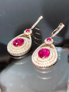 Excellent quality laser AAAAA grade cz set in 925 Sterling silver with man made rubellite oval shape stones. Pink Oval Ruby Earrings, Porter Ranch, Sapphire Pendant, Emerald Earrings, Gorgeous Earrings, Oval Shape, Jewelry Earrings Dangle, Etsy Earrings, Dangle Drop Earrings