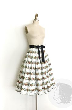 vintage skirt  Era: 1950's Label: none Material: cotton Closure: side metal zipper, button waist Colour: white, browns, green, tan  Details: small floral print that forms a striped pattern and a classic pleated full skirt silhouette. Medium size waist band and a full pleated skirt Fits like: small Waist: 26" Hips: free Length: 29.5" Condition: Excellent other than a small grey spot in the middle which, looks like a print irregularity. The waist ribbon is not original. Priced accordingly.  Washed Ruby Mae, 1950s Skirt, 1950’s Fashion, Small Floral Print, Rose Vintage, Skirt Fits, 50s Fashion, Floral Stripe, 1950s Vintage