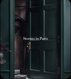 an open door with the words storms in paris on it and a vase full of flowers