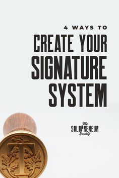 a wooden stamp with the words create your signature system