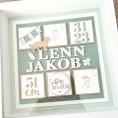 a white frame with some pictures on it and a sign that says leann jakob