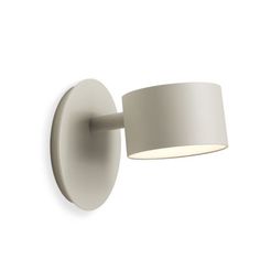 a white wall light with a round shade on the top and bottom half of it