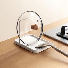 a table top with a phone and some sort of device on it's stand