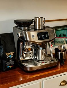 a coffee maker sitting on top of a wooden counter