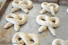 some pretzels are sitting on a baking sheet