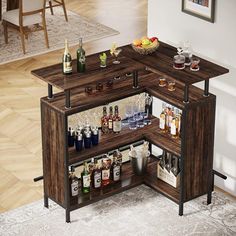 an open cabinet with liquor bottles and glasses on the shelves in front of a dining room table