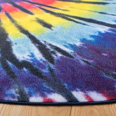 a multicolored area rug on the floor