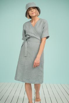 "Linen wrap dress with dolman sleeves falls just below the knees creating feminine, subtle, casually elegant look. Express your freedom, radiate your natural beauty and charm wearing it this summer! Suitable for any time of the day during hot season and super comfortable for maternity period. DETAILS - Loose-fit style - V neckline - Short dolman sleeves - Wide sleeves - Long waist ties - Side seam pockets - 100% midweight European softened (washed) linen fabric - Oeko Tex certified linen - Cut a Elegant Mid-length Summer Wrap Dress, Solid Color Surplice Neckline Dress With Tie Waist, Dress With Tie Waist And Surplice Neckline, Solid Dresses With Surplice Neckline And Tie Waist, Dresses With Tie Waist And Surplice Neckline, Elegant Summer Wrap V-neck Dress, Solid Color Spring Wrap Dress, Relaxed Fit V-neck Dress With Tie Waist, Summer Mid-length Wrap Dress