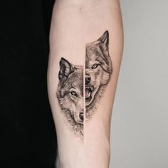 two wolf tattoos on the left thigh