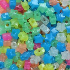 there are many different colored plastic beads