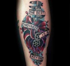 a tattoo on the leg of a man with an engine and wrench in it