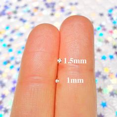 two fingers are marked with the same size as each other, and one finger has three small stars on it