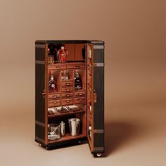 an open cabinet with liquor bottles and glasses in it on a brown background, showing the contents inside