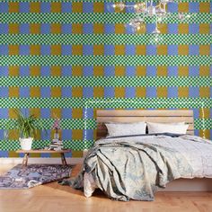 a bedroom with blue, green and yellow checkered wallpaper