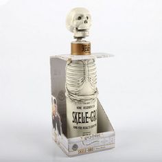 a skeleton bottle in a box on a white background