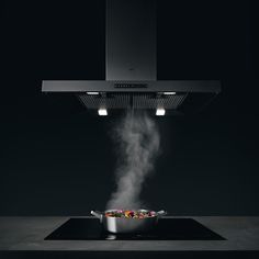 a stove top with steam coming out of it