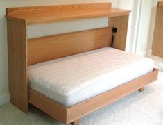 a bed with a wooden headboard and foot board is shown in this image, it appears to be made out of wood