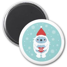 a white bear wearing a santa hat and holding a red heart in its paws refrigerator magnet