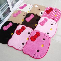 hello kitty bathroom rugs on the floor in front of a window with polka dots