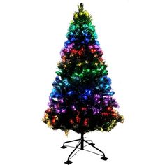 a multicolored christmas tree on a stand with lights in the shape of a star