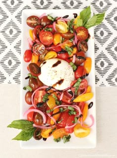 a white plate topped with lots of different types of vegetables