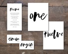 four cards with the words one, two, and three written in black ink on them