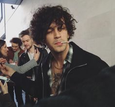 a group of young men standing next to each other