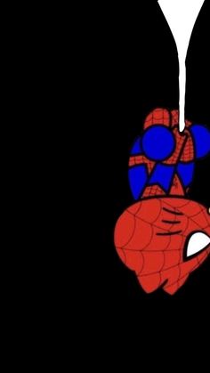 a spider man hanging from the side of a black wall