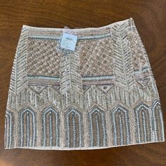 Hattie Embellished Mini Skirt By Club Monaco This Hand Embroidered Sequin And Beaded Mini Skirt Is Beautiful! I Bought It With Nye In Mind And Ended Up Not Wearing It. New With Tags. A Few Loose Threads But Otherwise In New Condition. Comes With Additional Beads And Sequins. Size 00. Includes Shades Of Blush, Tan, Rose Gold, Gold, And Silver Beads. Luxury Glamorous Sequined Mini Skirt, Glamorous Luxury Embellished Mini Skirt, Beaded Skirt Long, Beaded Mini Skirt, Goddess Attire, Chloe 2024, Crochet Store, Gold Mini Skirt, Tambour Beading