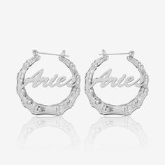 Personalize these classic hoop earrings with your name, the name of a loved one, or a special word. Crafted from 18K gold and silver plating, this piece is made to last. The bigger the hoops, the bigger the statement! Details: Personalize With: Names, Numbers, or Words. Pendant Size varies by name (3cm-5cm) Name Hoop Earrings, Special Words, Personalized Necklace, Gold Plated Silver, Material Design, Silver Hoop Earrings, Gold And Silver, Precious Metals, Personalized Jewelry