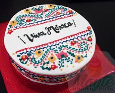 a decorated cake with the words i love you written on it and an embroidered border