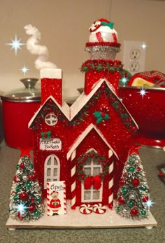 a gingerbread house is decorated with candy canes