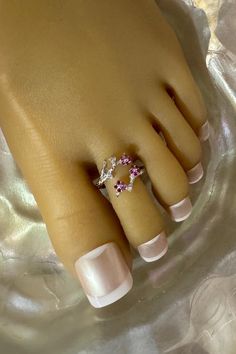 This toe ring features a shiny silver branch that wraps around the toe. Three petite pink crystal flowers and three clear crystal accents sit on the branch that also adorn the toe. This toe ring is size adjustable and one size fits most. Comfortable and versatile, it will lend itself to casual or formal events. All items are made in a smoke free environment. *If there is any issue with your toe ring, please let me know so that I can correct it. Thanks for visiting my shop!👣 Toes Ring Silver, Toe Ring Designs, Columbia Tn, Sterling Silver Toe Rings, 2 Flowers, Ring Crystal, Silver Toe Rings, Ring Flower, Toe Ring