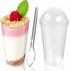 a dessert in a glass next to a plastic container with a spoon and strawberries on top