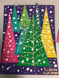 three christmas trees made out of construction paper on a purple background with white polka dots