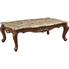 a marble top coffee table with ornate carvings on the legs and base, in an antique style