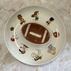 a football plate with cartoon stickers on it