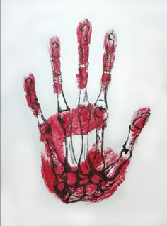 a drawing of a hand with red paint on it