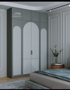 a bedroom with gray walls and white closets