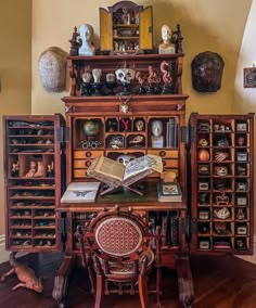 an old fashioned desk with lots of books on it