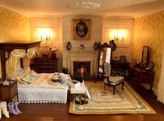 a doll house bedroom with furniture and accessories on the floor in front of a fireplace