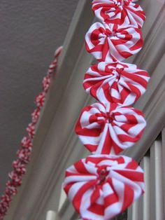 red and white candy canes hanging from the ceiling