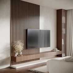 a large flat screen tv mounted to the side of a wall in a living room