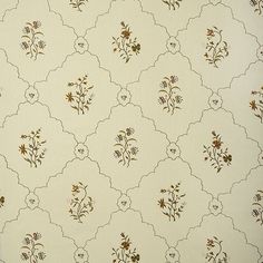 the wall paper has flowers on it and is white with brown trim around the edges