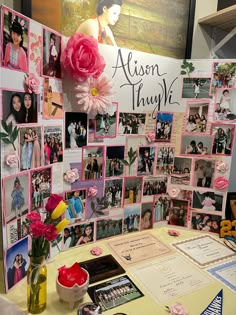 a table topped with lots of pictures and flowers