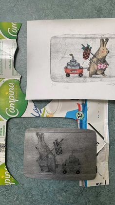 an envelope with some drawings on it next to papers and other items that include scissors