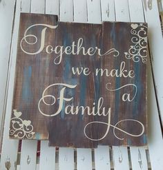 a wooden sign that says together we make a family on it, sitting on a white bench