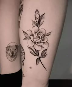 two tattoos on both legs with a dog and rose